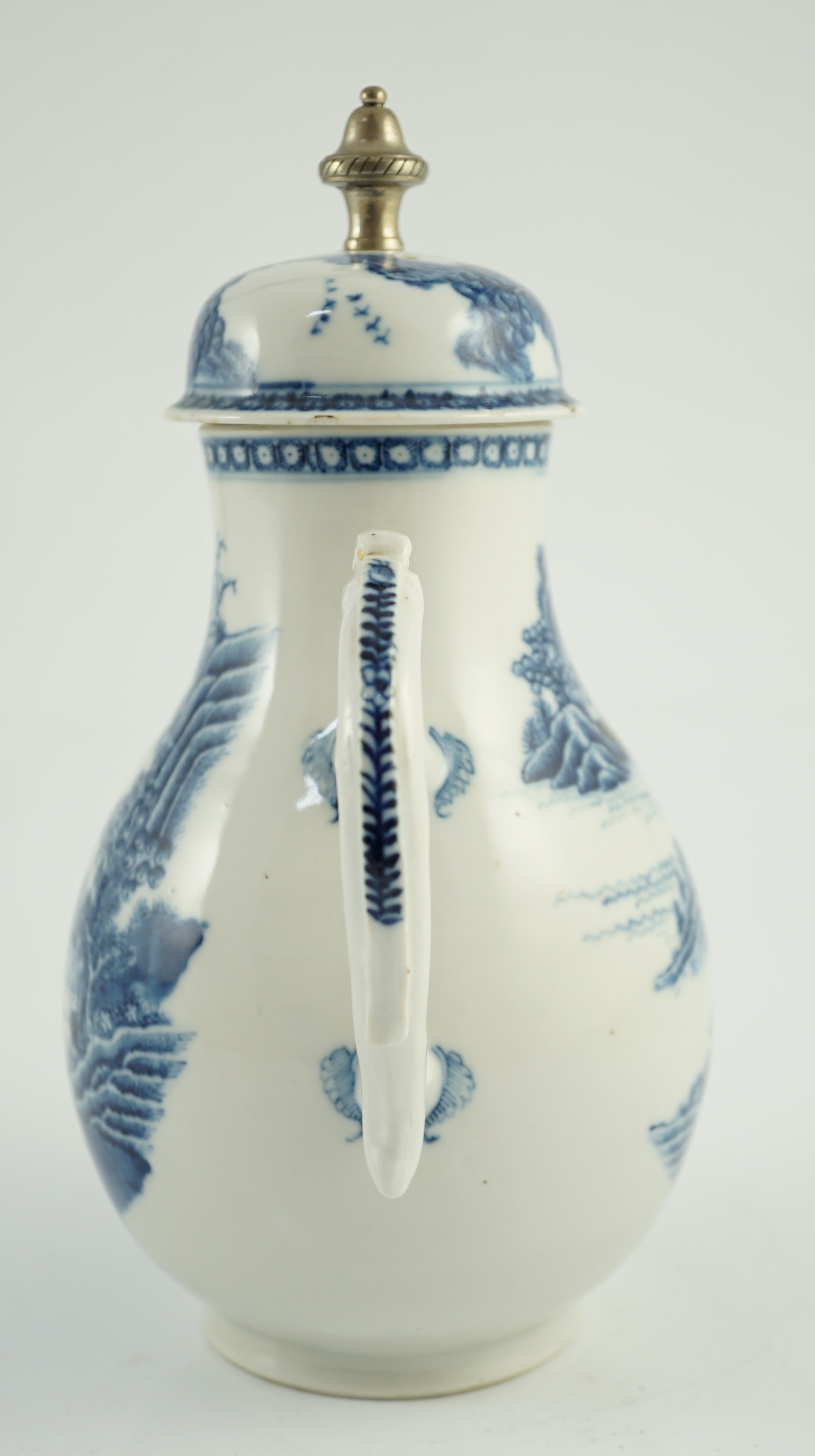 A Chinese blue and white jug and cover, Qianlong period, later metal finial